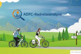 Bild mit zwei Radfahrern die durch eine Landschaft fahren